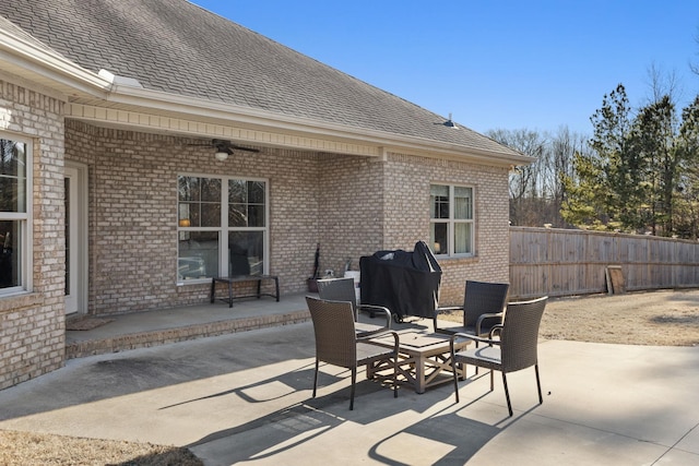 view of patio with a grill and ceiling fan