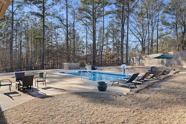 view of swimming pool featuring a patio area