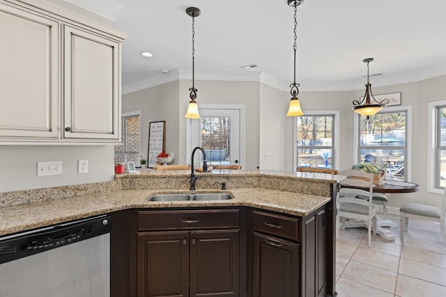 kitchen featuring sink, light stone counters, hanging light fixtures, dark brown cabinets, and stainless steel dishwasher