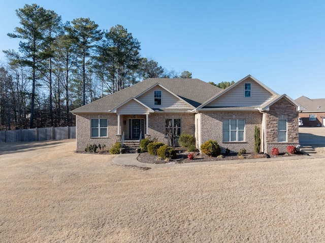 craftsman-style house with a front lawn