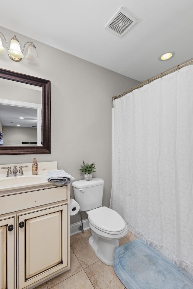 bathroom with tile patterned floors, vanity, and toilet