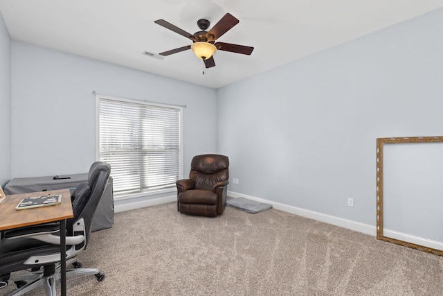 carpeted office with ceiling fan