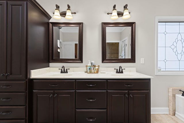 bathroom featuring vanity and a washtub