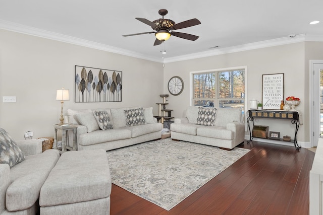 living room with crown molding, dark wood-type flooring, and ceiling fan