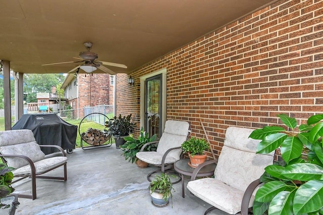 view of patio with grilling area and ceiling fan