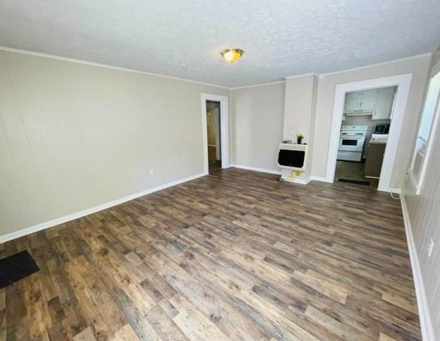 unfurnished living room featuring a textured ceiling, dark hardwood / wood-style floors, heating unit, and crown molding