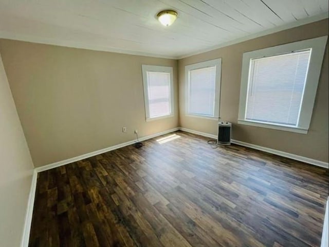 spare room featuring dark wood-type flooring