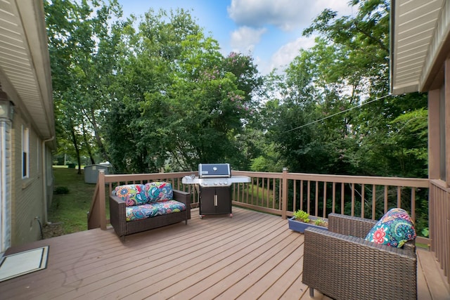  - wooden terrace with area for grilling and an outdoor hangout area