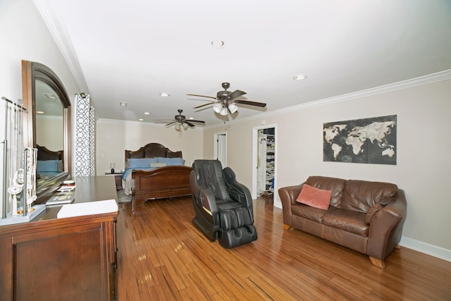  - bedroom featuring wood finished floors, crown molding, recessed lighting, and ceiling fan