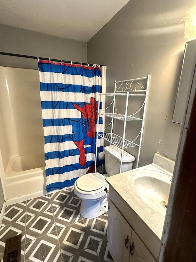  - bathroom with vanity, toilet, and shower / bath combo with shower curtain