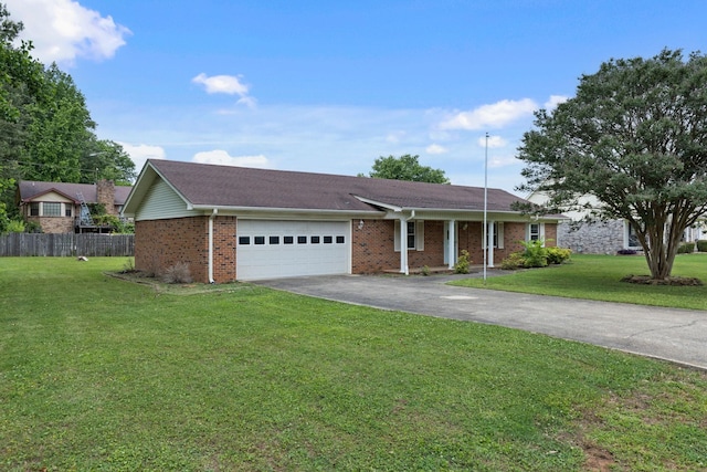  - ranch-style house featuring driveway, a garage, and brick siding