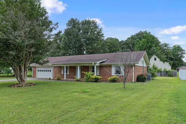  - ranch-style house featuring a garage, central AC, a front yard, asphalt driveway, and brick siding