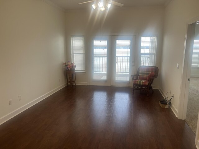  - unfurnished room featuring ceiling fan, ornamental molding, and dark wood-style flooring