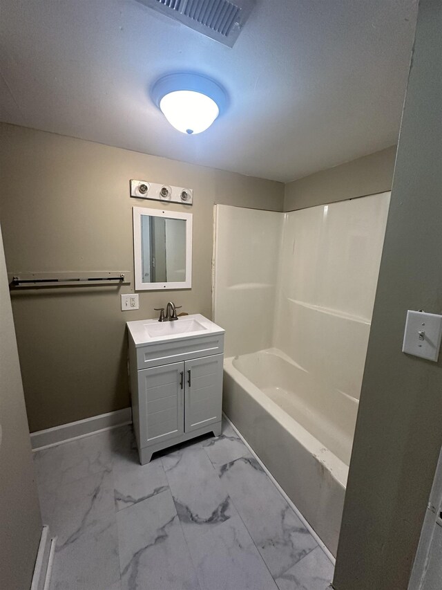 bathroom with vanity and shower / washtub combination