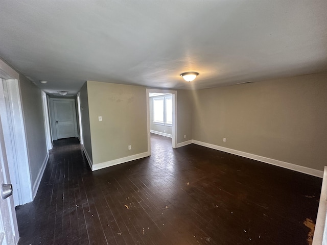 spare room featuring dark hardwood / wood-style floors