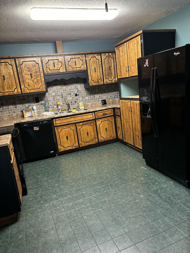 kitchen featuring black appliances, tasteful backsplash, and brown cabinets