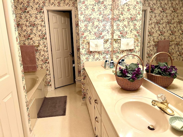 bathroom featuring a bath and vanity