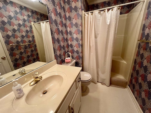 bathroom with vanity, toilet, walk in shower, and ornamental molding