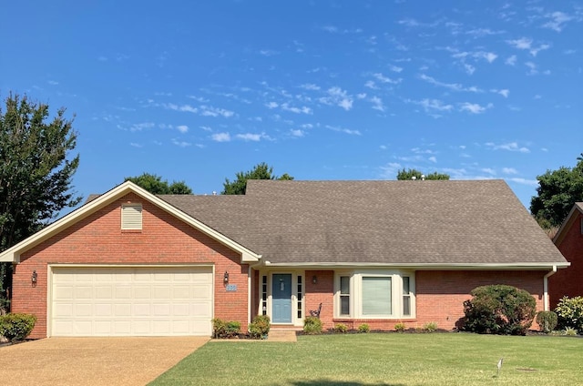 ranch-style home with a front lawn and a garage