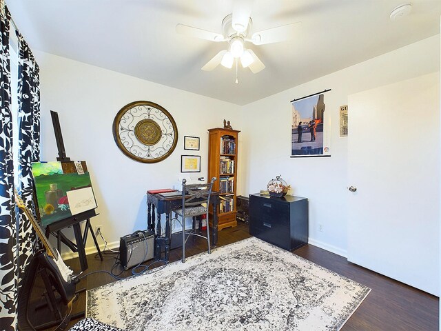 office area featuring dark hardwood / wood-style floors and ceiling fan