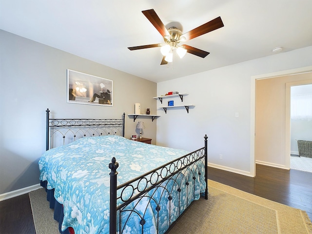 bedroom featuring ceiling fan and dark hardwood / wood-style flooring