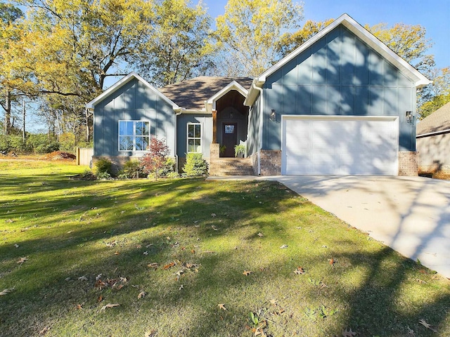 view of front of home with a garage and a front yard