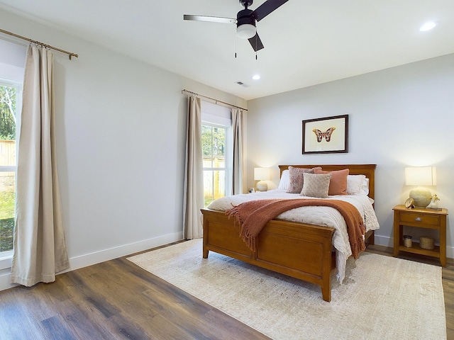 bedroom with hardwood / wood-style floors and ceiling fan