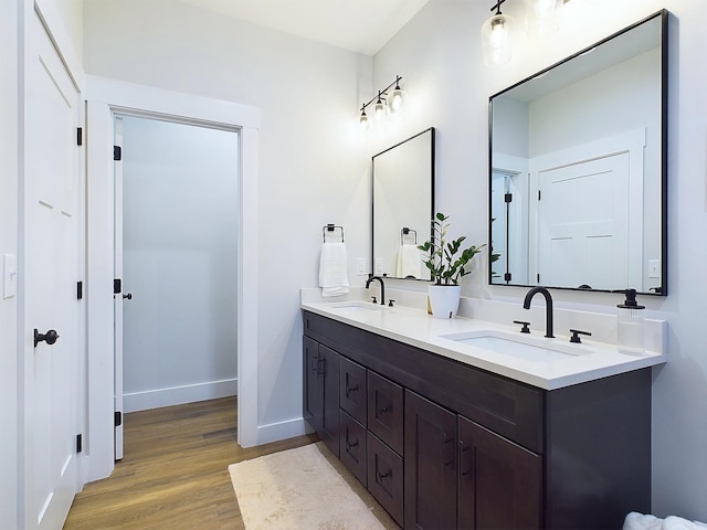 bathroom featuring vanity and hardwood / wood-style flooring