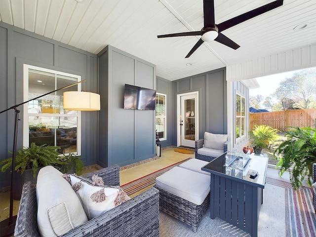 exterior space with ceiling fan