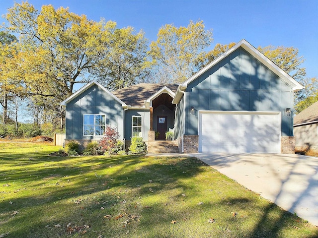 view of front facade with a garage and a front lawn