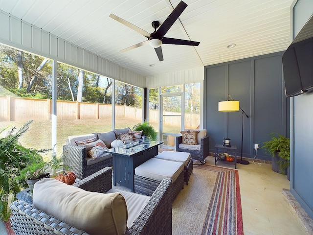 sunroom / solarium with ceiling fan and plenty of natural light