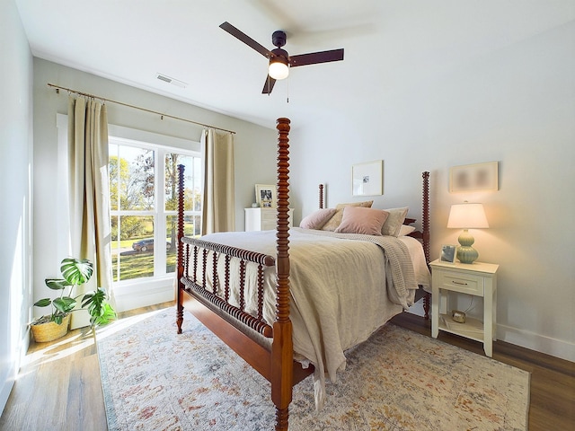 bedroom featuring wood-type flooring and ceiling fan