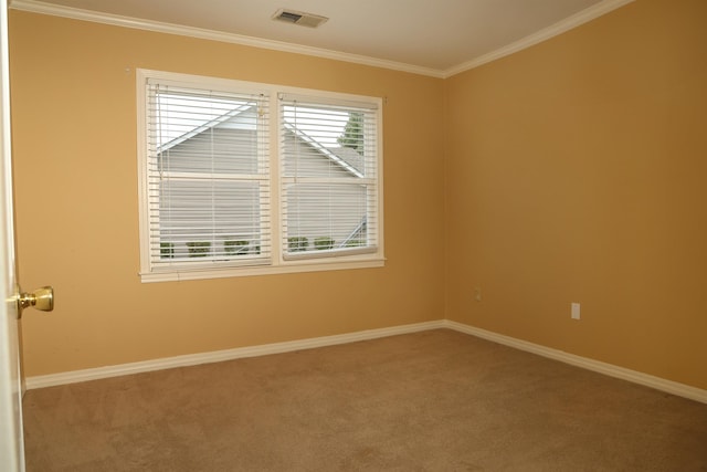 carpeted empty room featuring baseboards, visible vents, a wealth of natural light, and ornamental molding