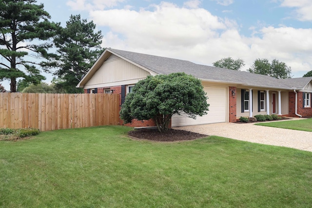 ranch-style home featuring a garage, driveway, fence, a front lawn, and brick siding