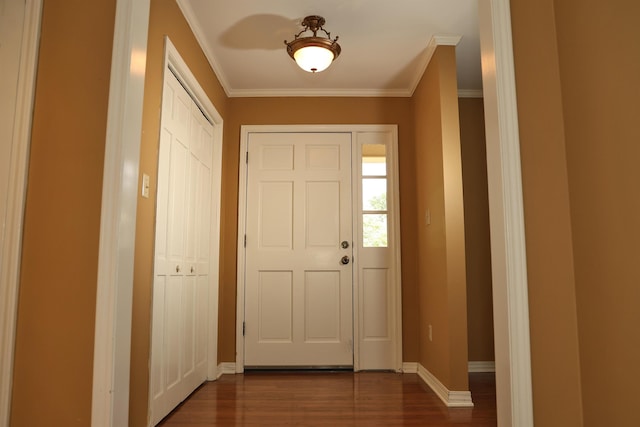 entryway with baseboards, dark wood finished floors, and crown molding