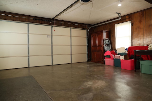 garage featuring wooden walls