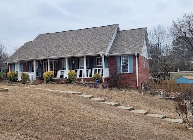 view of front of property with covered porch and a front lawn