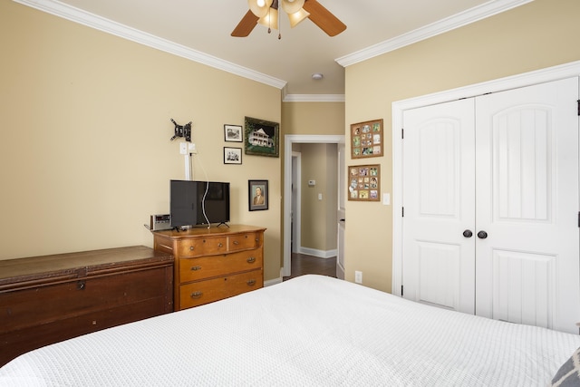  - bedroom with crown molding, a closet, and a ceiling fan
