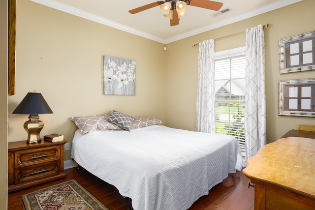  - bedroom with hardwood / wood-style floors, ornamental molding, and ceiling fan