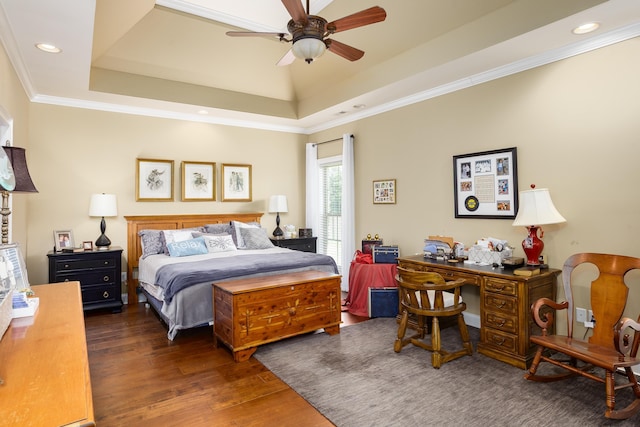  - bedroom featuring a raised ceiling, wood finished floors, recessed lighting, ornamental molding, and a ceiling fan