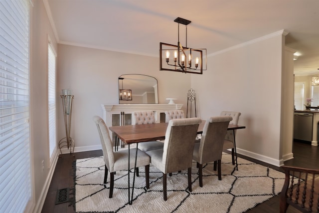 dining area with crown molding, baseboards, and wood finished floors