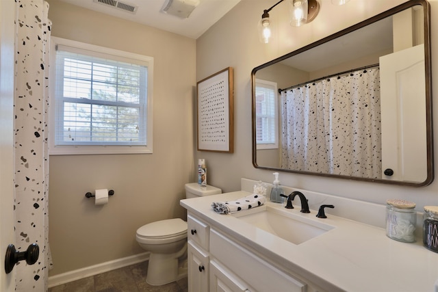 bathroom with curtained shower, toilet, visible vents, vanity, and baseboards