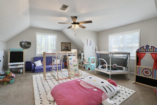 bedroom with lofted ceiling, a ceiling fan, visible vents, and carpet flooring