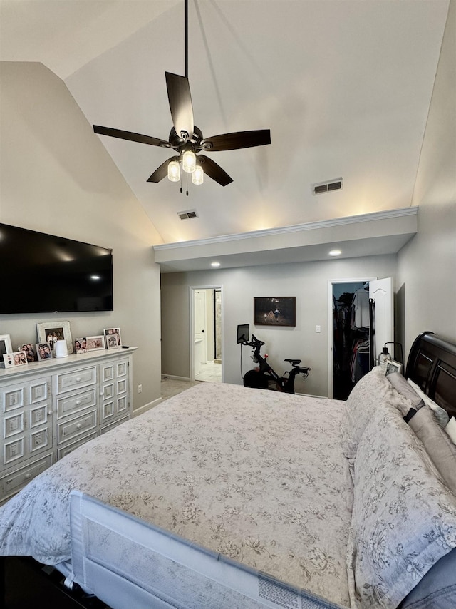 bedroom with high vaulted ceiling, a walk in closet, visible vents, and a ceiling fan