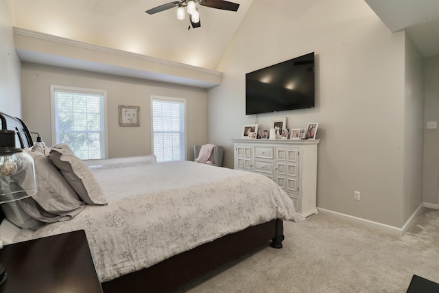 carpeted bedroom with lofted ceiling, ceiling fan, and baseboards