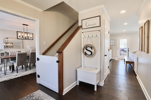 hallway featuring a notable chandelier, crown molding, dark wood-style flooring, and recessed lighting