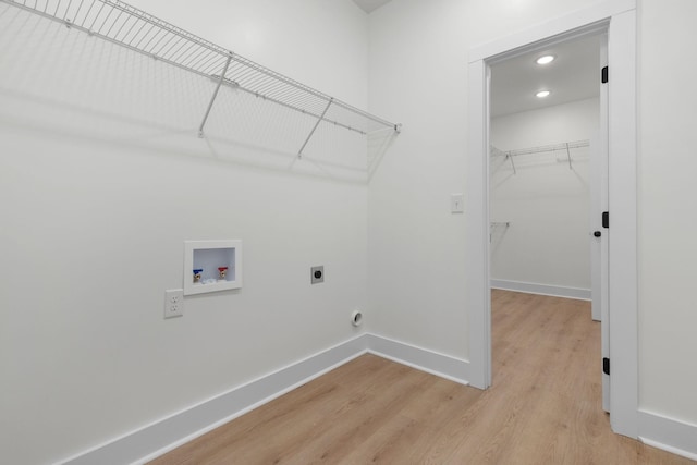 laundry area with washer hookup, hookup for an electric dryer, light wood-style flooring, baseboards, and recessed lighting