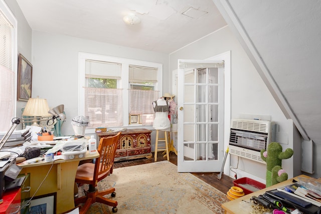  - office space featuring heating unit, wood finished floors, and vaulted ceiling