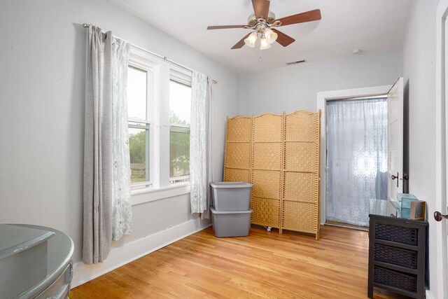  - bedroom featuring light wood finished floors and ceiling fan