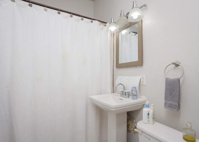 - full bathroom with toilet and curtained shower